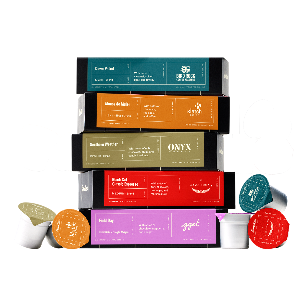 Mixed Roast Curated Box featuring five colorful coffee capsule boxes stacked with matching capsules and cups displayed below