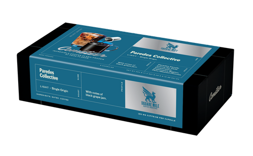 Paredes Collective coffee box in turquoise and black packaging with Three Keys Coffee branding and single-origin details